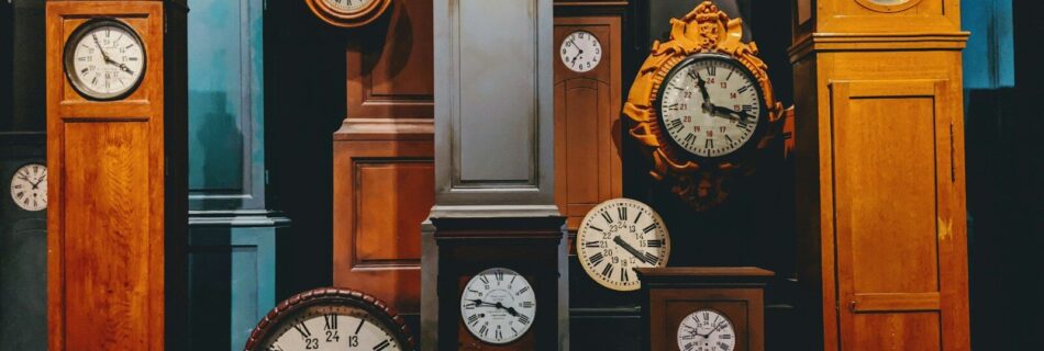 brown wooden framed analog clock
