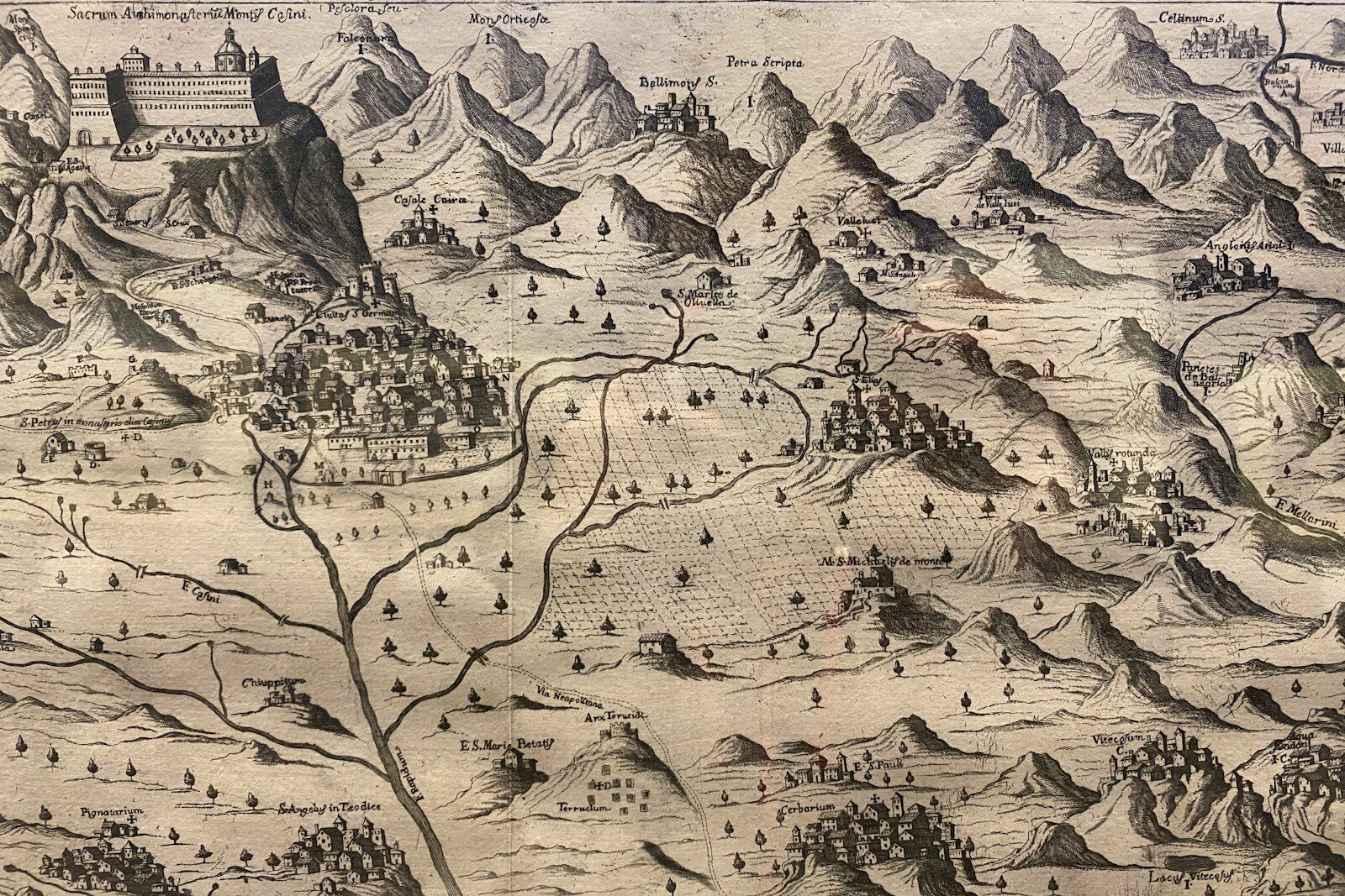 Antique map of a mountainous landscape with a river.